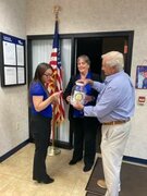 Niamh Walsh was the lucky winner of the raffle drawing held that NBT bank under the watchful eye of Rotarians Jennifer Slauson and Eric Van Benschoten.